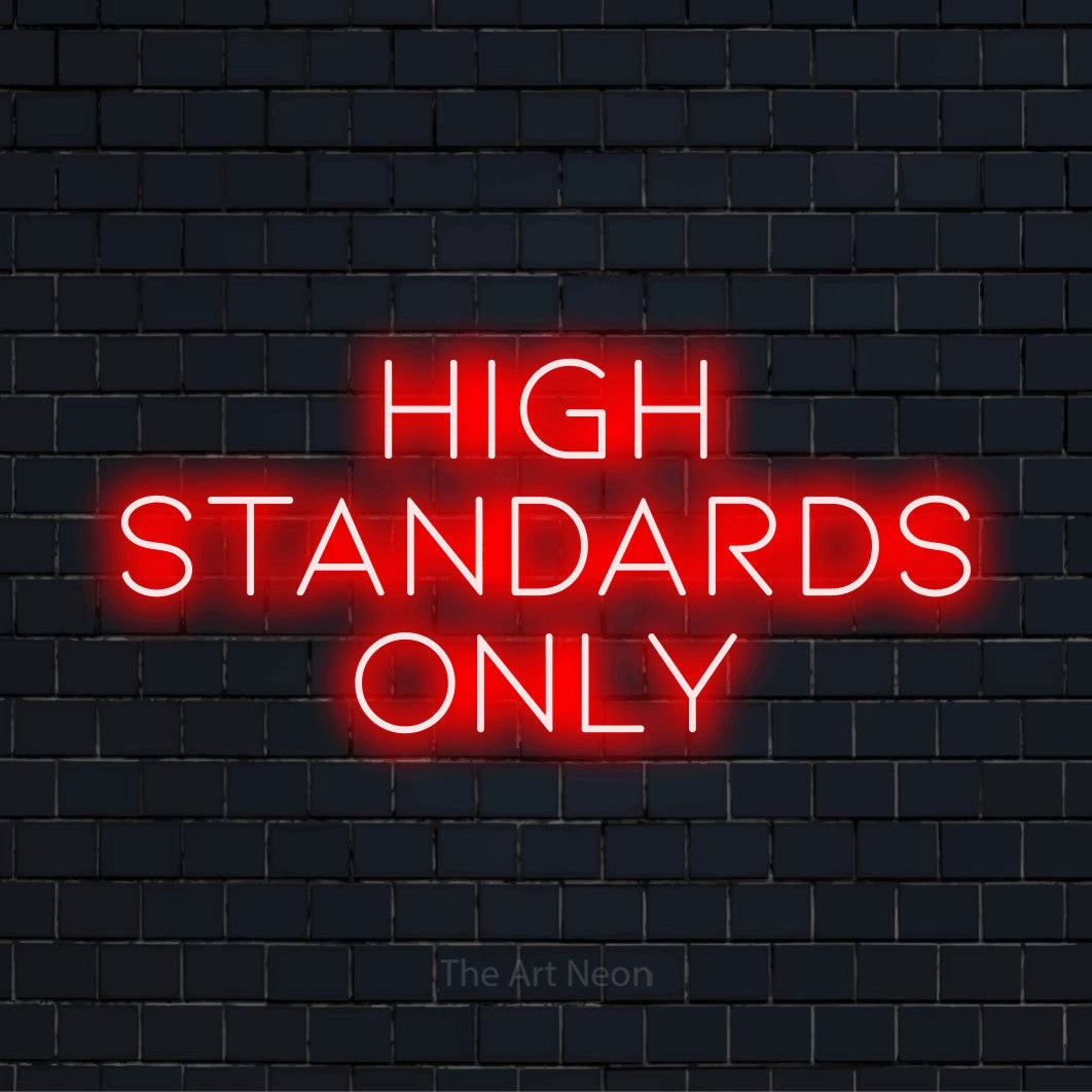 "High Standards Only" LED neon sign on a black brick wall