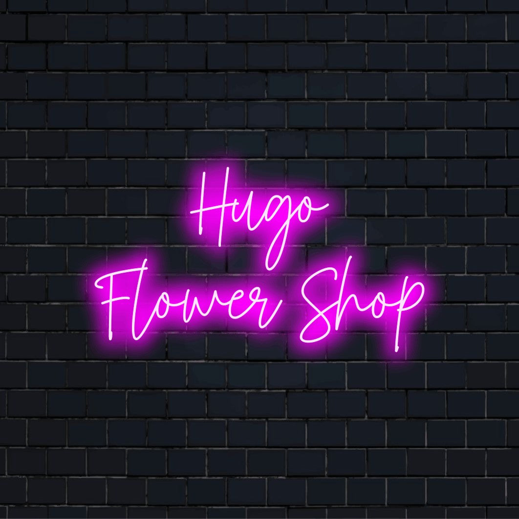 Hugo Flower Shop Custom Name Neon Sign, soft neon glow against brick backdrop