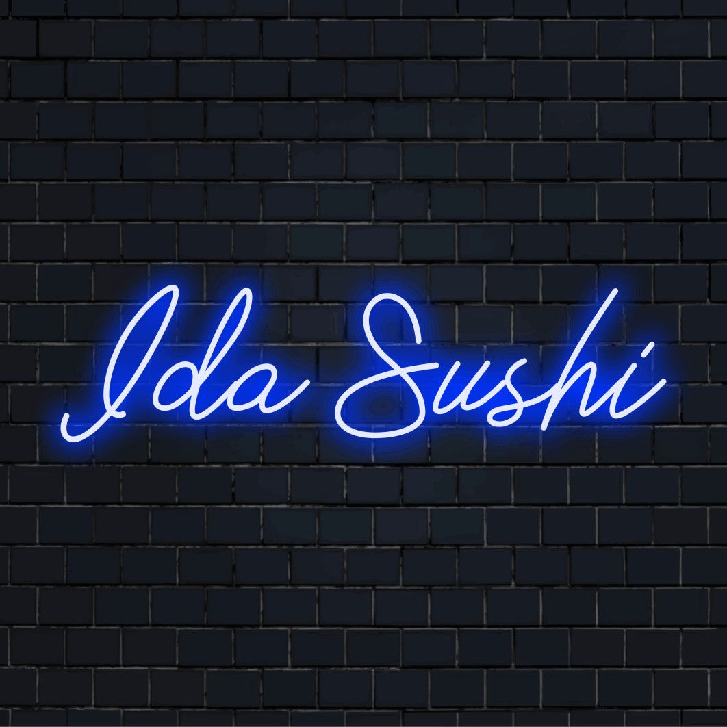Ida Sushi Personalized LED Neon Sign, bright neon glow on dark brick wall