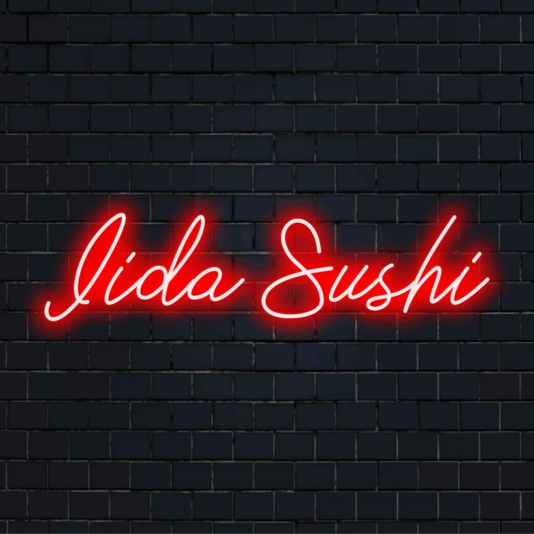 Iida Sushi Personalized Neon Light with bright LED glow on dark brick background