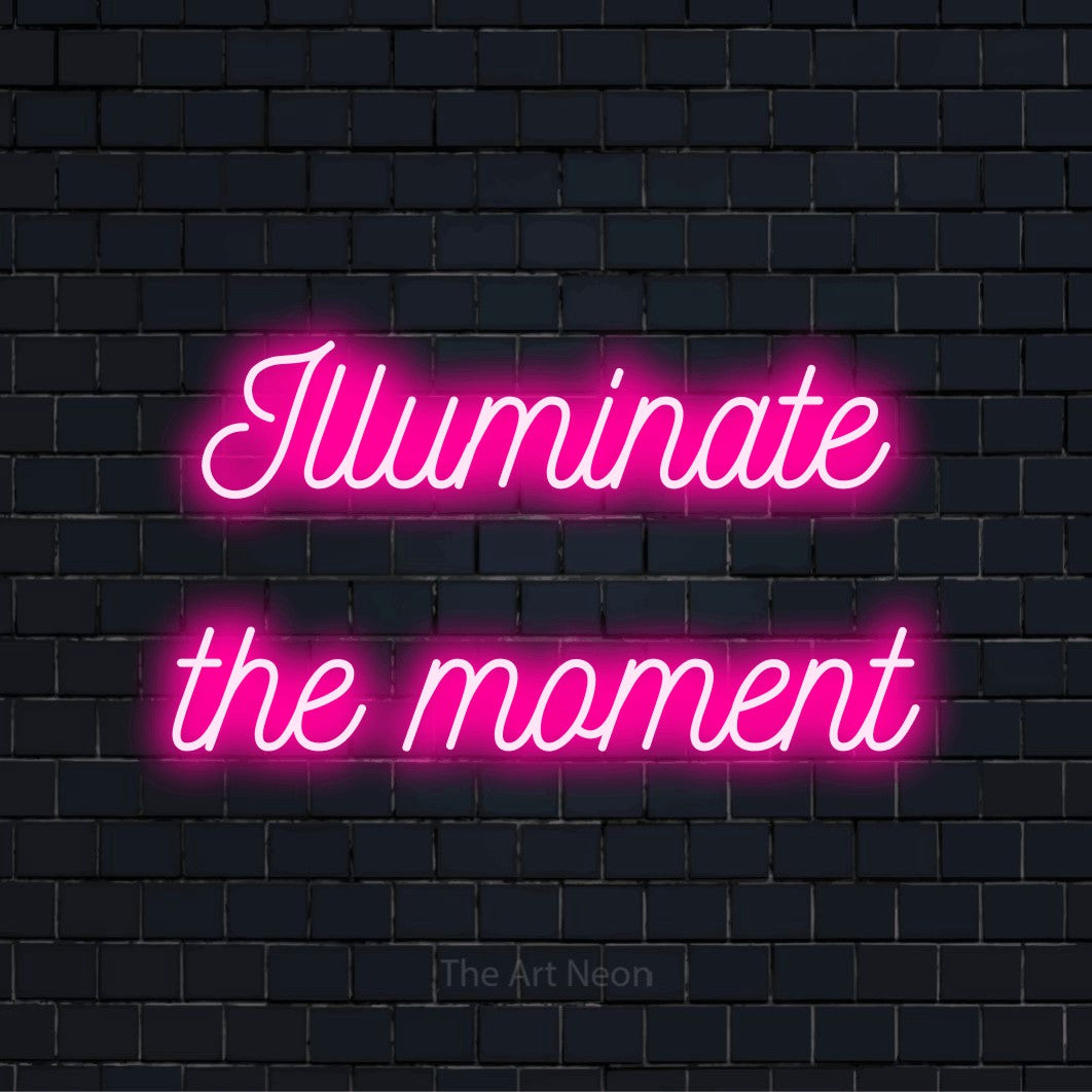"Illuminate The Moment" LED neon sign on a black brick wall