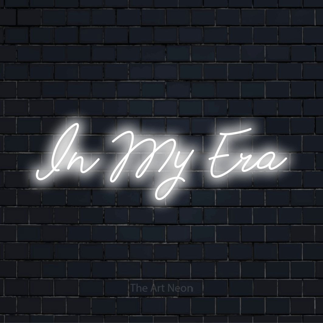"In My Era" neon text design on a black brick wall