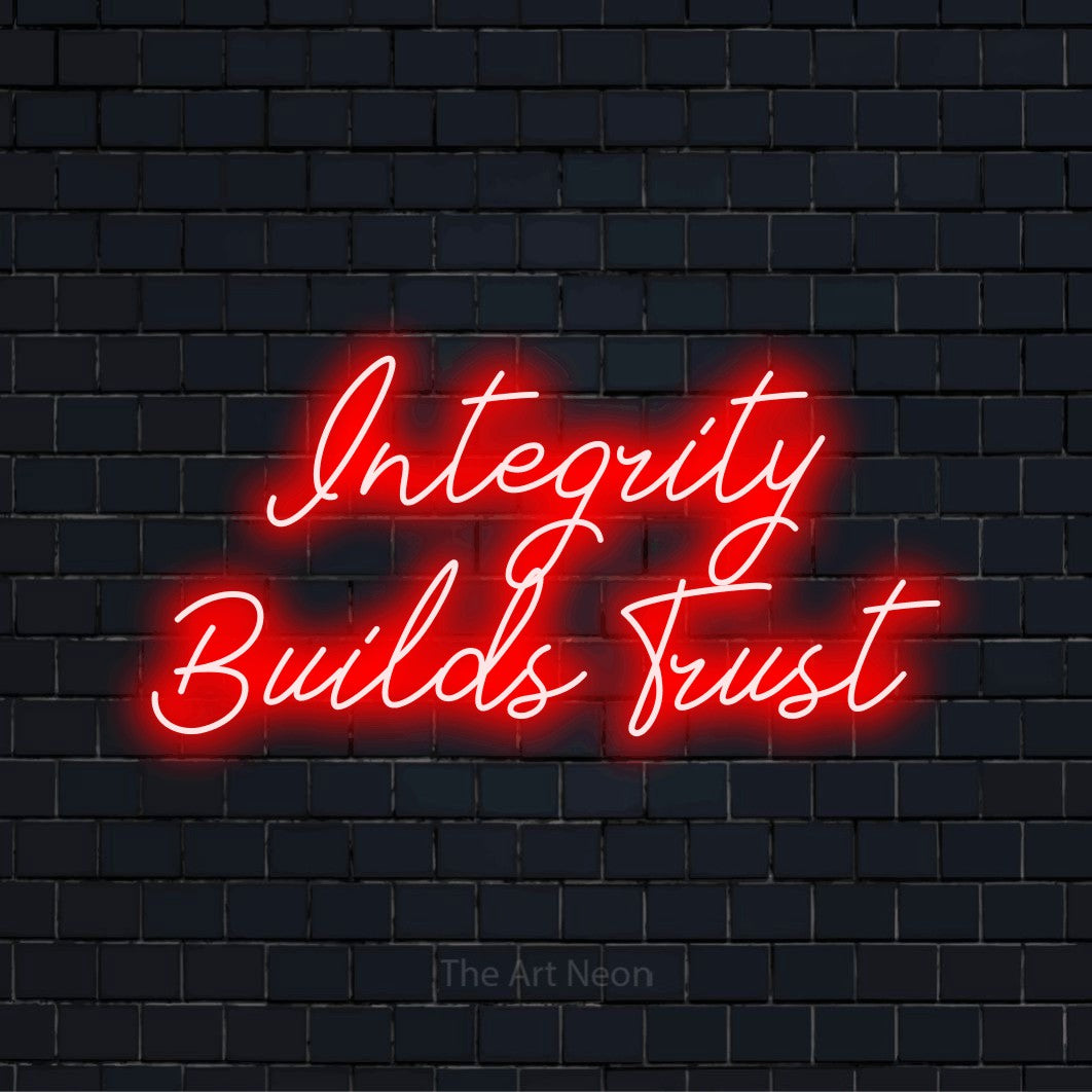 "Integrity Builds Trust" glowing LED neon sign on a black brick wall