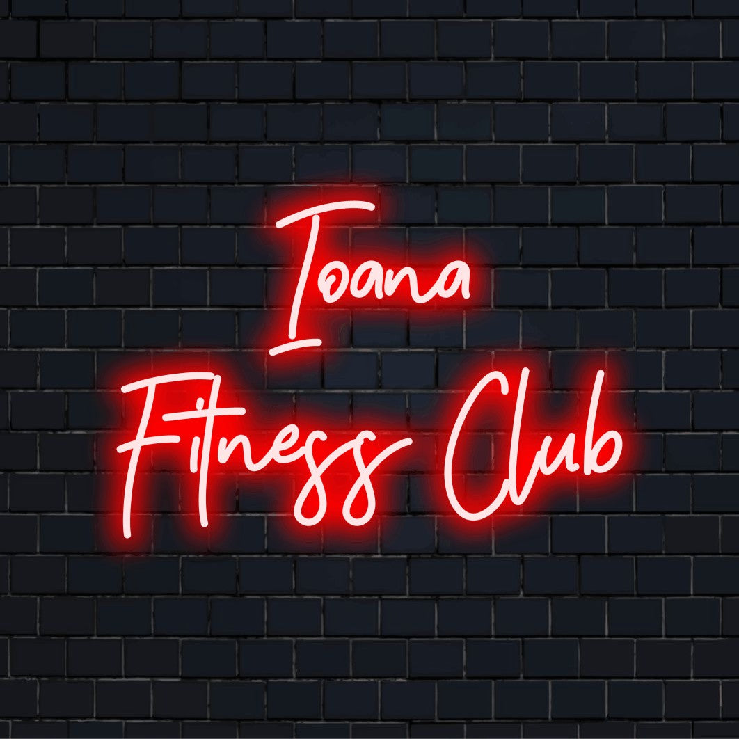Ioana Fitness Club Personalized Neon Light with soft neon glow against black brick wall