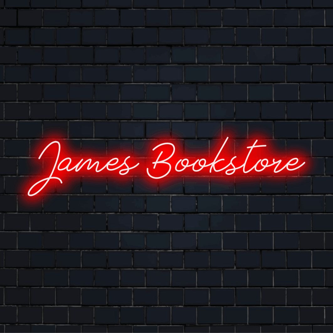 James Bookstore Custom Name Neon Sign, bright LED glow against black brick wall