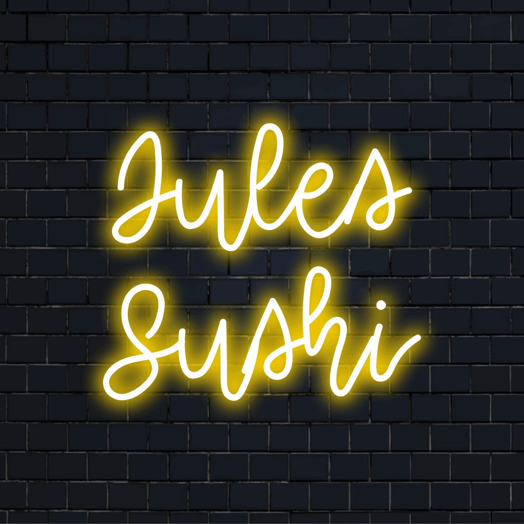 Jules Sushi Custom Name Neon Sign, bright LED glow on black brick background