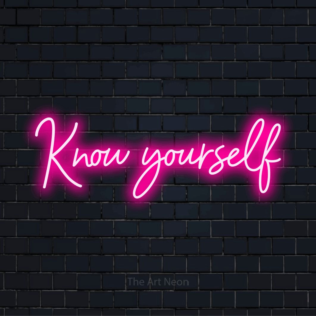 "Know Yourself" glowing LED neon sign on a black brick wall
