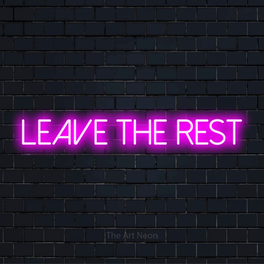 "Leave The Rest" neon text design on a black brick wall