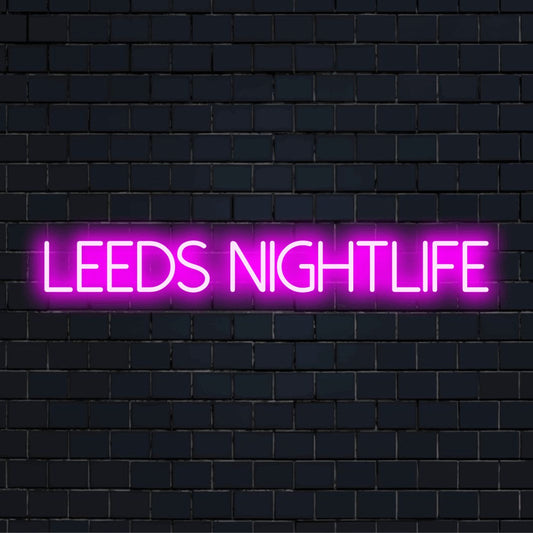 Leeds Nightlife LED Neon Sign, bright neon lettering on black brick background