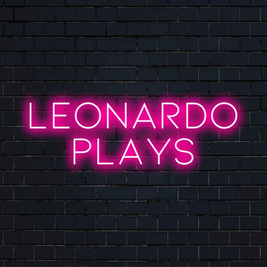 Leonardo Plays Personalized LED Neon Sign, soft neon glow on dark brick background