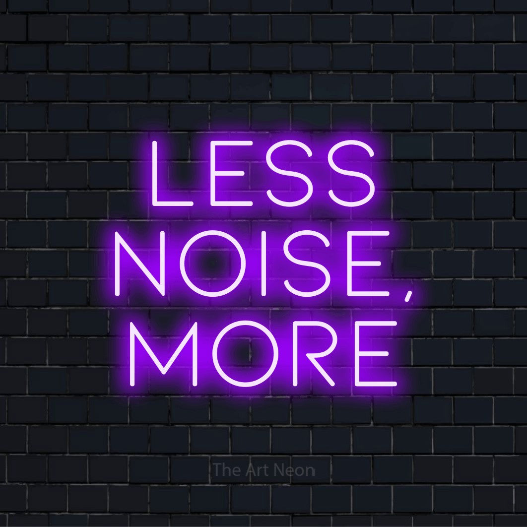 "Less Noise, More" LED neon sign on a black brick wall