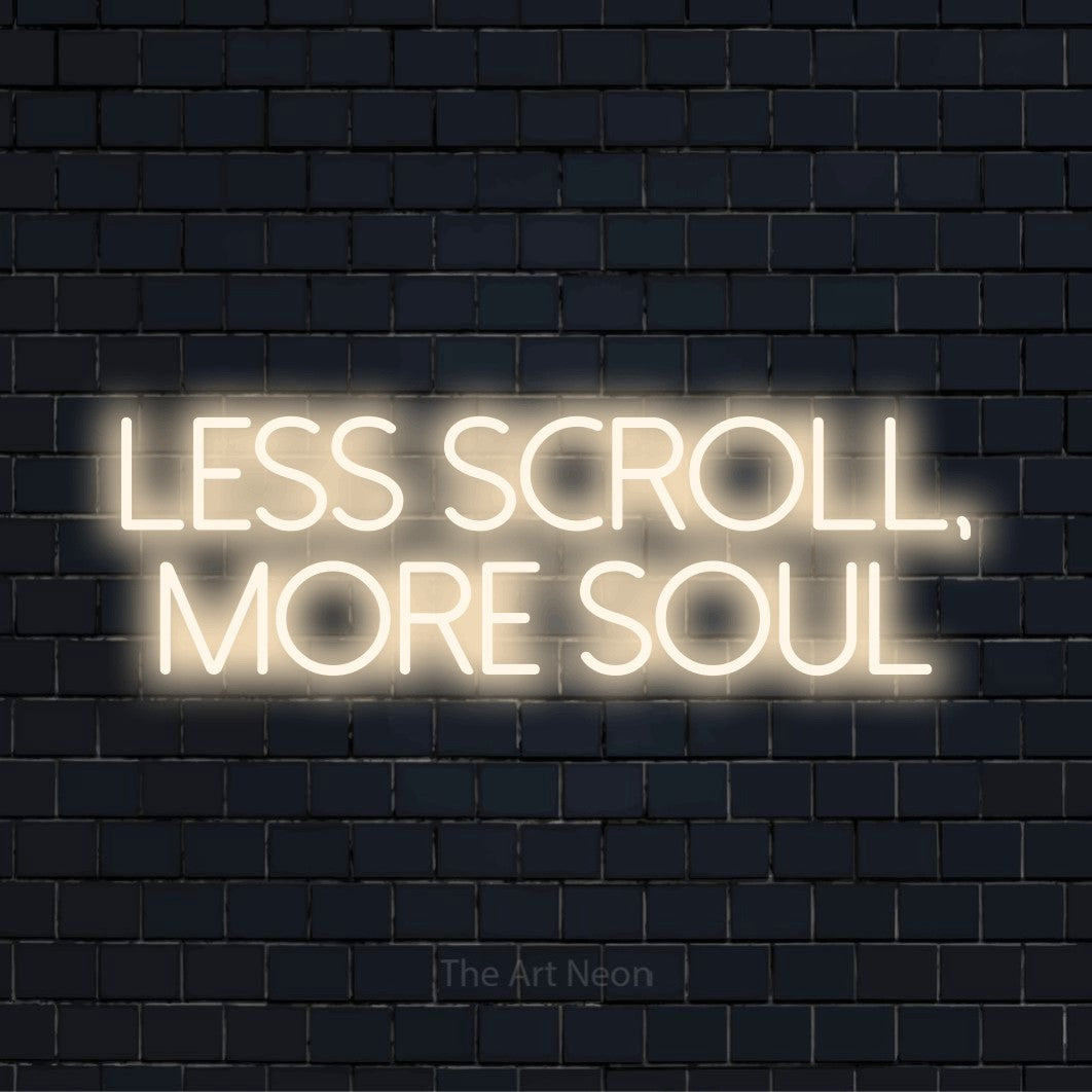 "Less Scroll, More Soul" glowing LED neon sign on a black brick wall