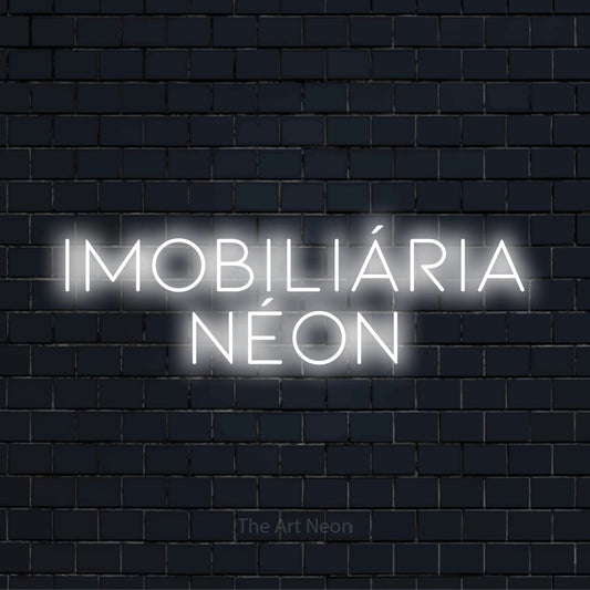 Letreiro néon LED com o design “Imobiliária Néon” numa parede escura
