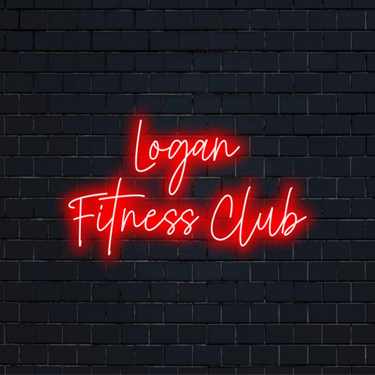 Logan Fitness Club Personalized Neon Light with soft neon glow on dark brick wall