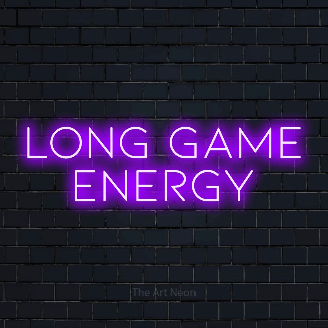 "Long Game Energy" LED neon sign on a black brick wall