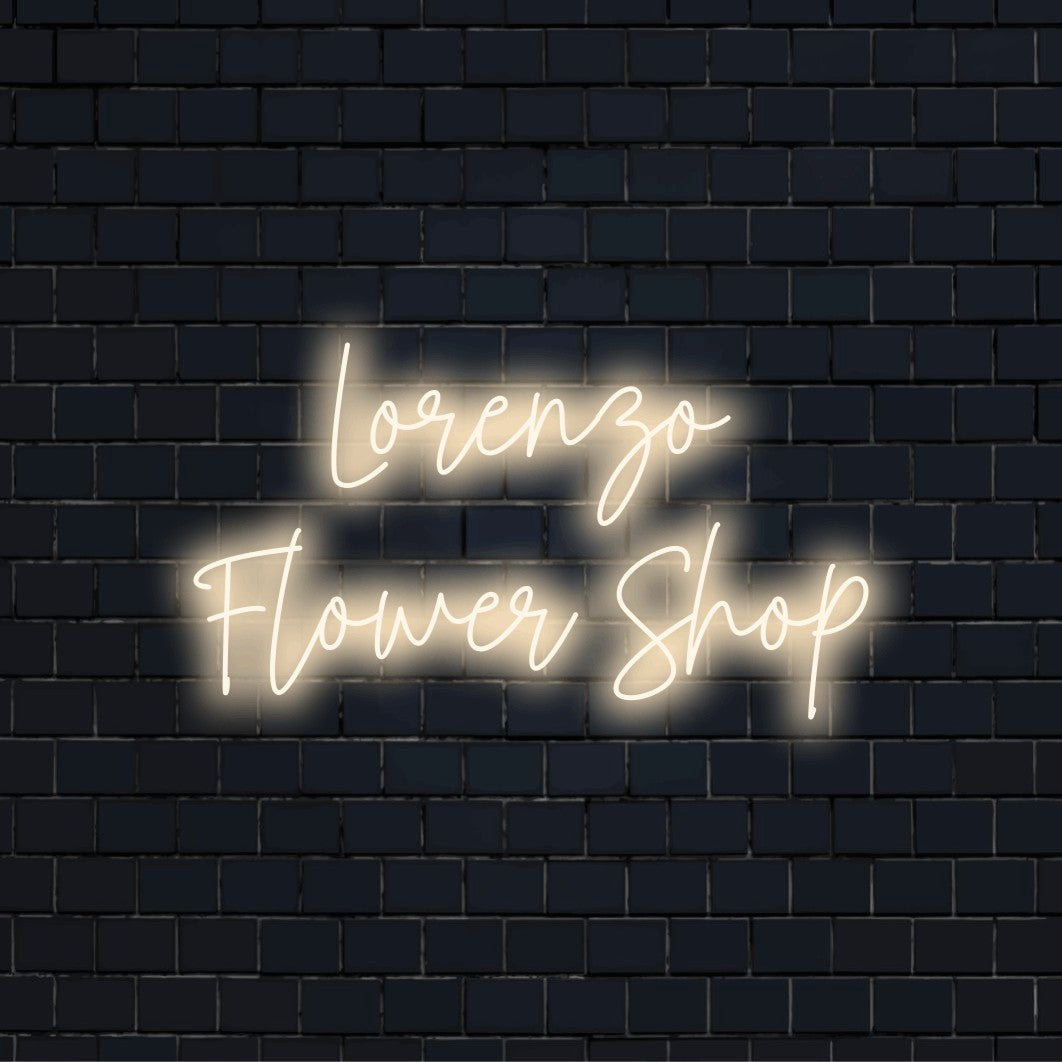 Lorenzo Flower Shop Personalized LED Neon Sign, glowing neon text on dark brick wall