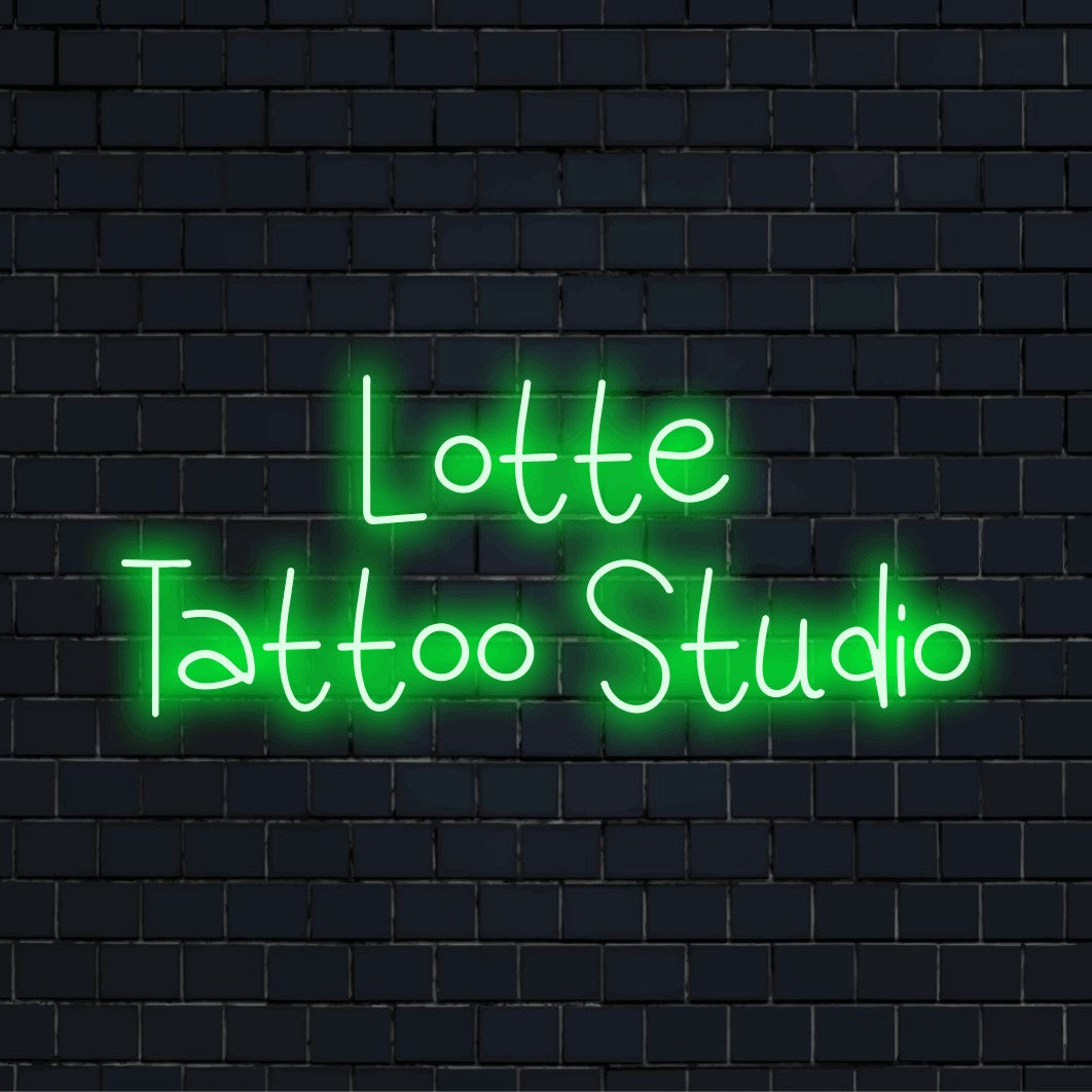 Lotte Tattoo Studio Personalized Neon Light with neon text light on dark brick wall