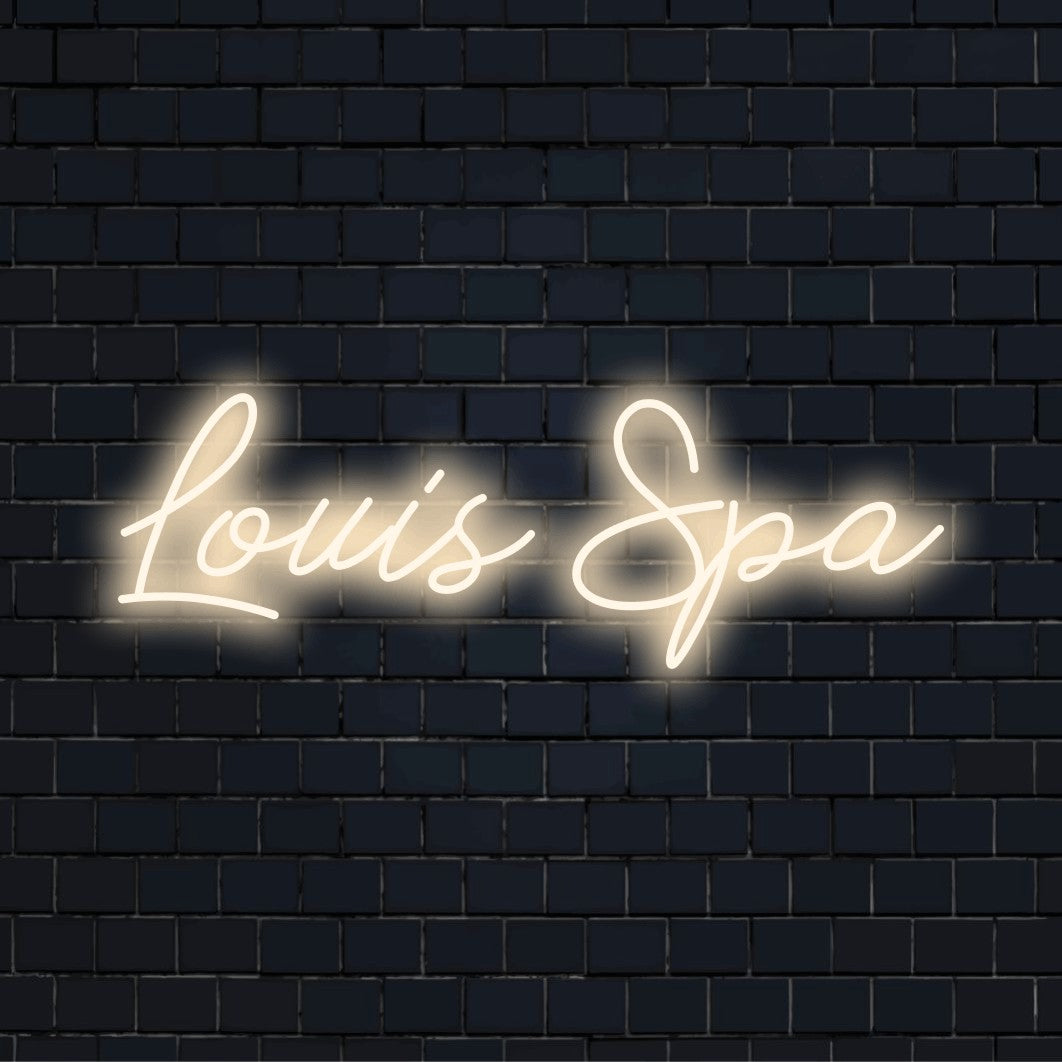 Louis Spa Personalized LED Neon Sign, bright neon lettering against black brick wall