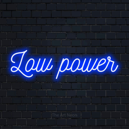 "Low Power" text design with neon effect on a black brick wall