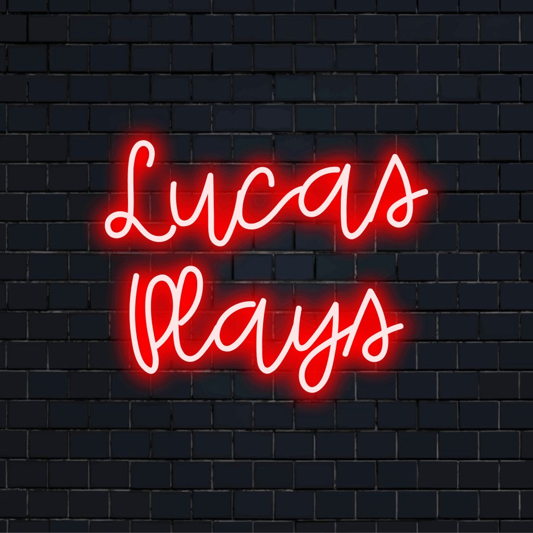 Lucas Plays Personalized LED Neon Sign, neon text light on dark brick wall