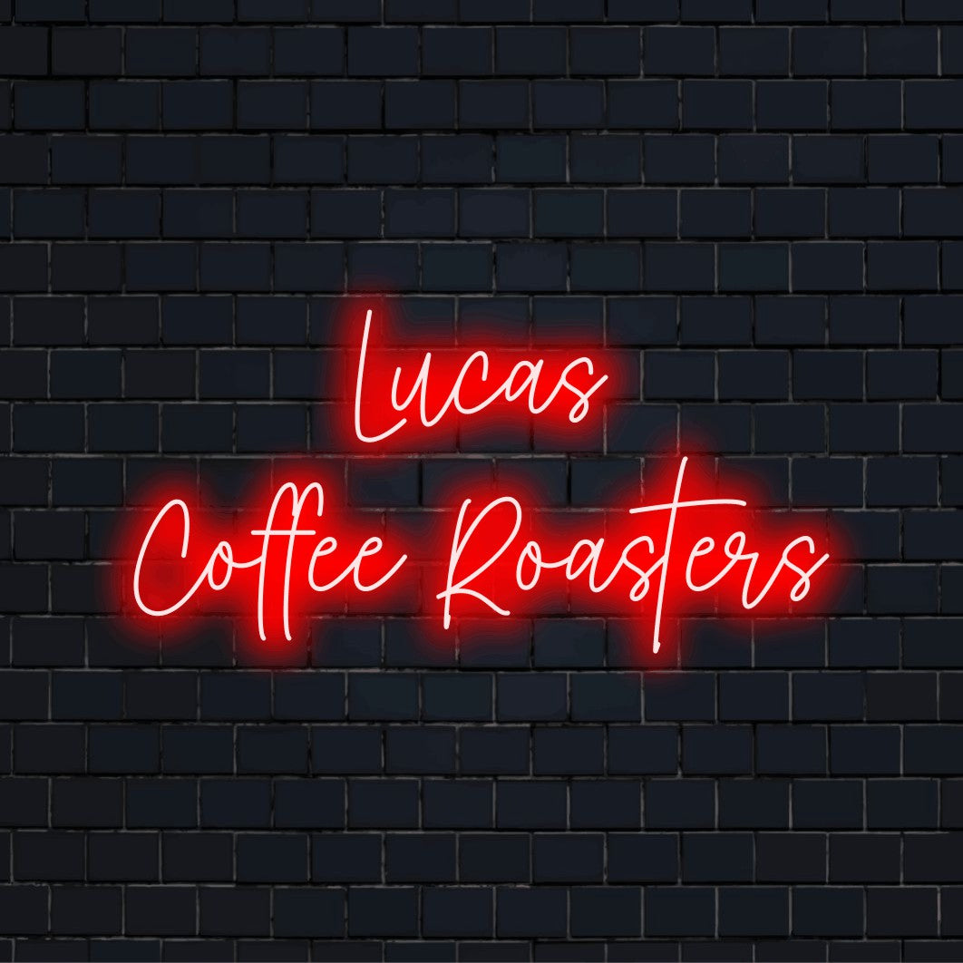Lucas Coffee Roasters Personalized LED Neon Sign, glowing lettering on black brick background