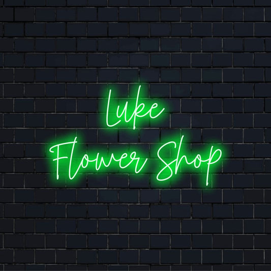 Luke Flower Shop Custom Name Neon Sign, glowing wall decor on dark brick wall