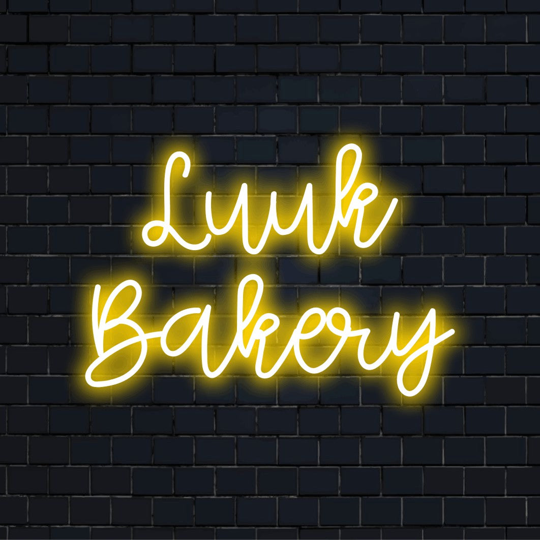 Luuk Bakery Personalized Neon Light with neon text light on black brick background