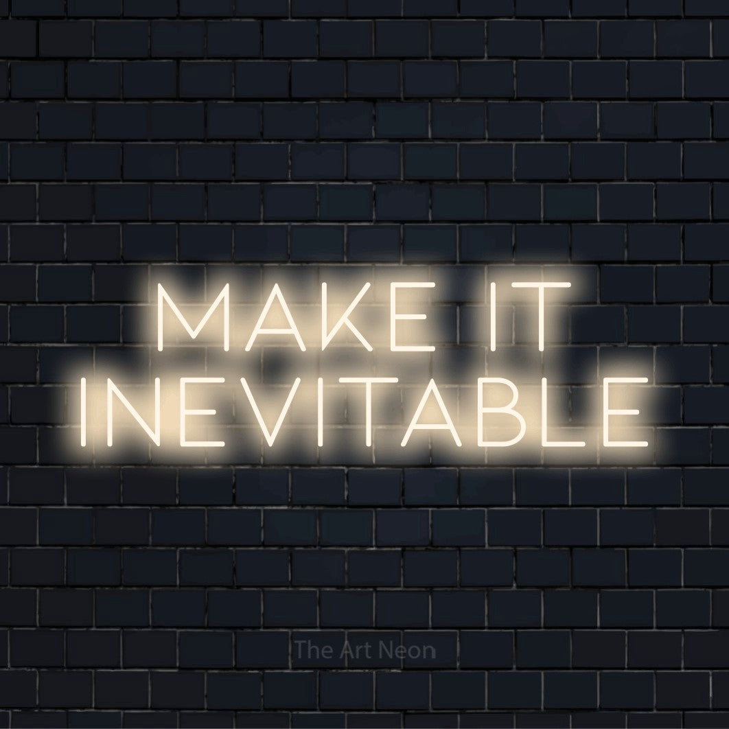 "Make It Inevitable" glowing LED neon sign on a black brick wall