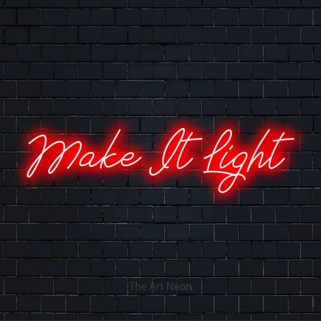 "Make It Light" script-style LED neon sign on a black brick wall