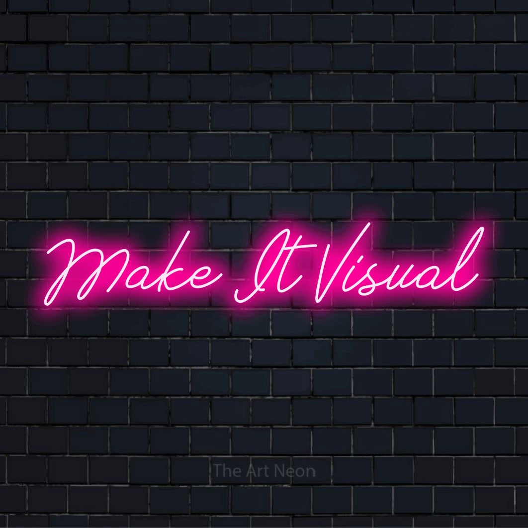 "Make It Visual" neon text design on a black brick wall