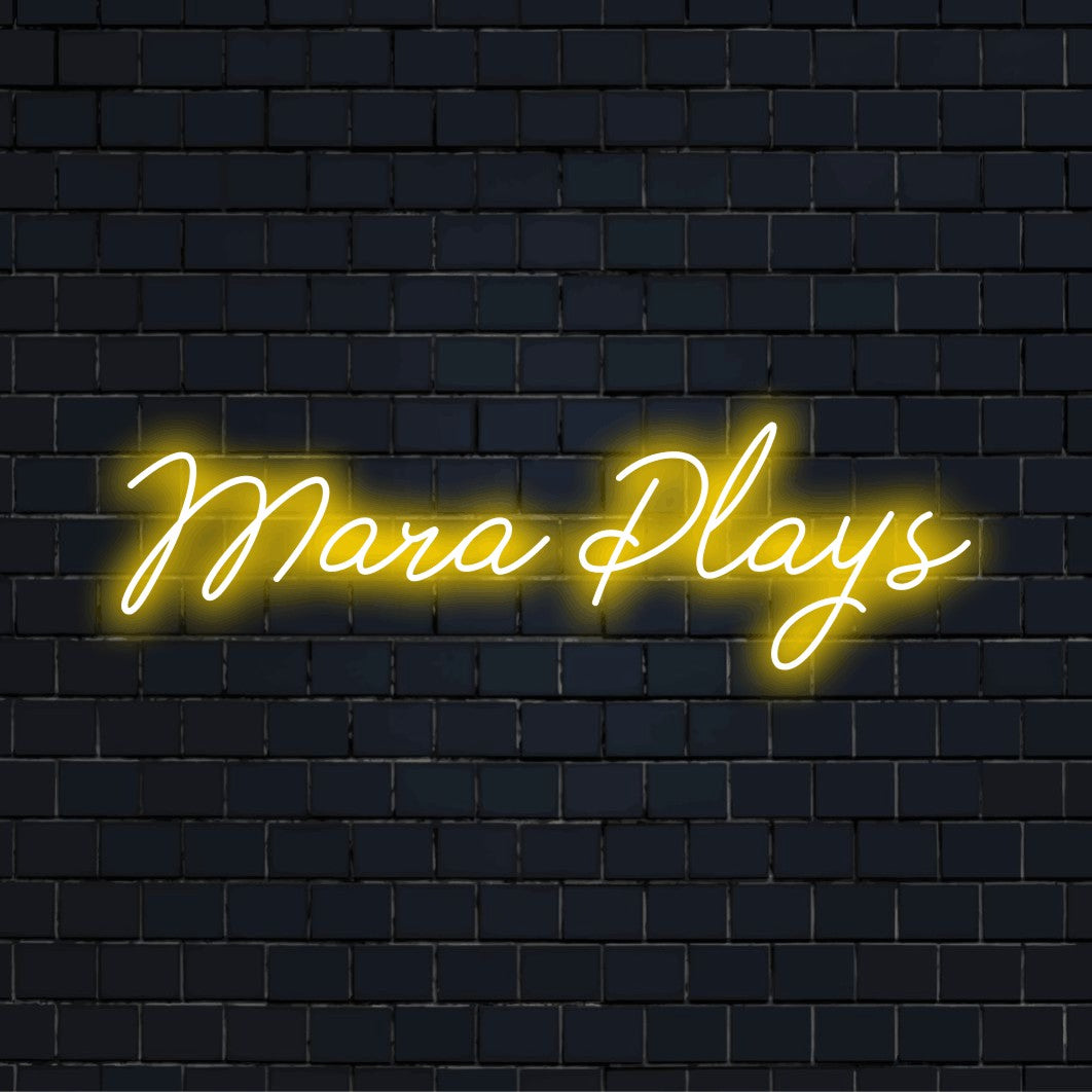 Mara Plays Personalized LED Neon Sign, glowing wall decor against brick backdrop