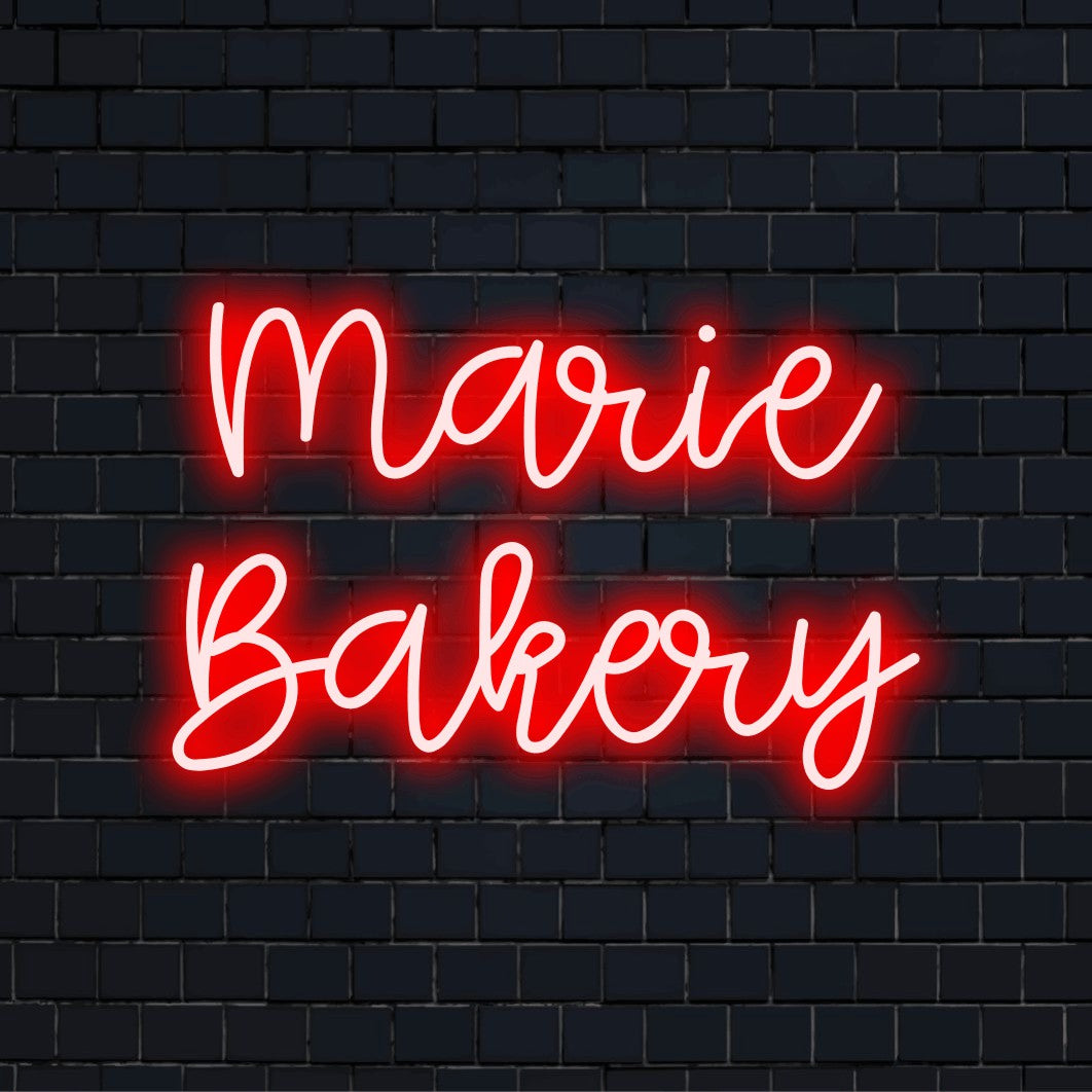 Marie Bakery Custom Name Neon Sign, bright LED glow on black brick background
