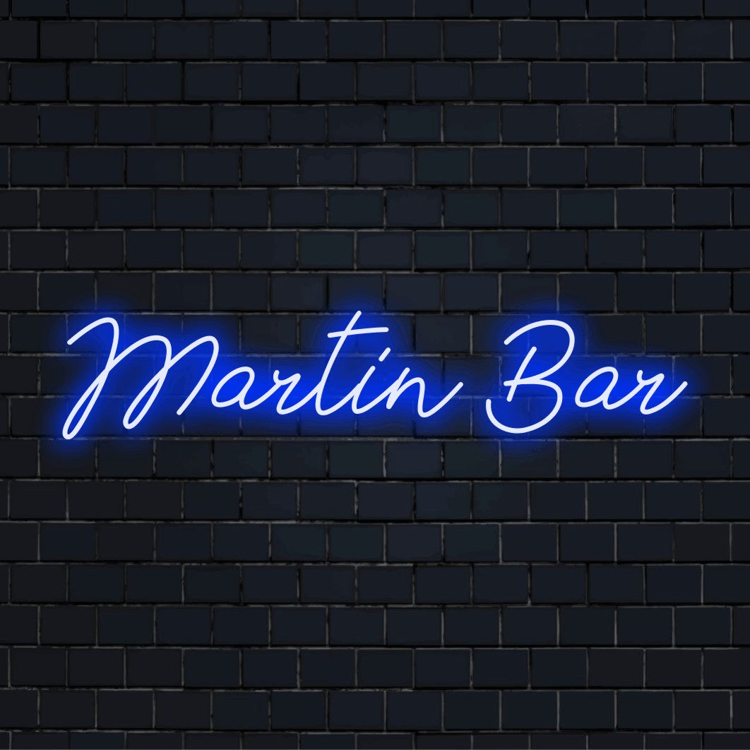 Martin Bar Personalized Neon Light with neon text light against brick backdrop