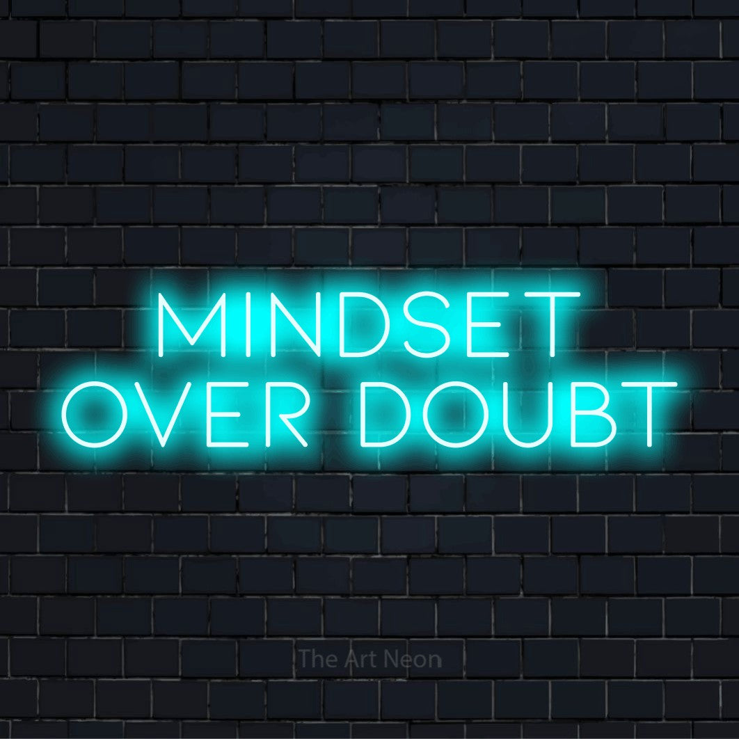 "Mindset Over Doubt" text design with neon effect on a black brick wall