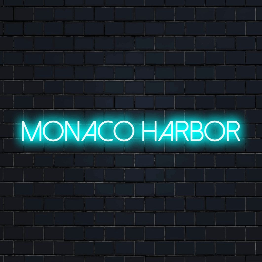 Monaco Harbor Neon Sign, bright neon glow against brick backdrop