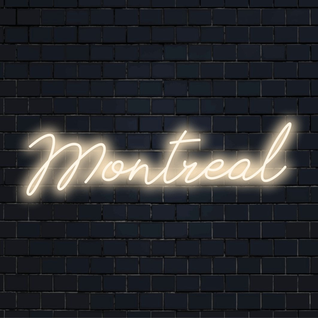 Montreal LED Neon Sign, glowing lettering against black brick wall
