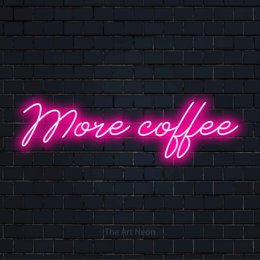 "More Coffee" glowing LED neon sign on a black brick wall