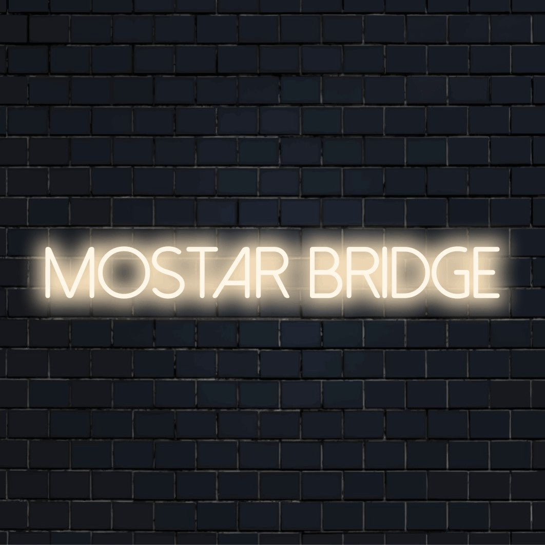 Mostar Bridge LED Neon Sign, neon text light on dark brick background