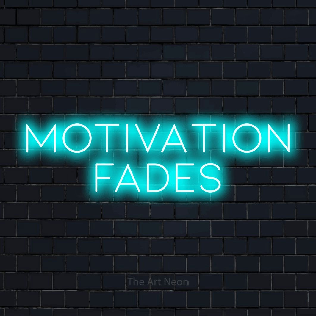 "Motivation Fades" neon text design on a black brick wall