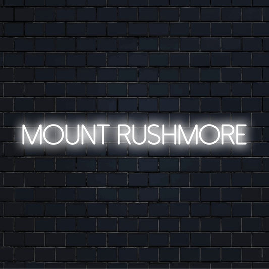 Mount Rushmore Neon Sign, glowing lettering on black brick background