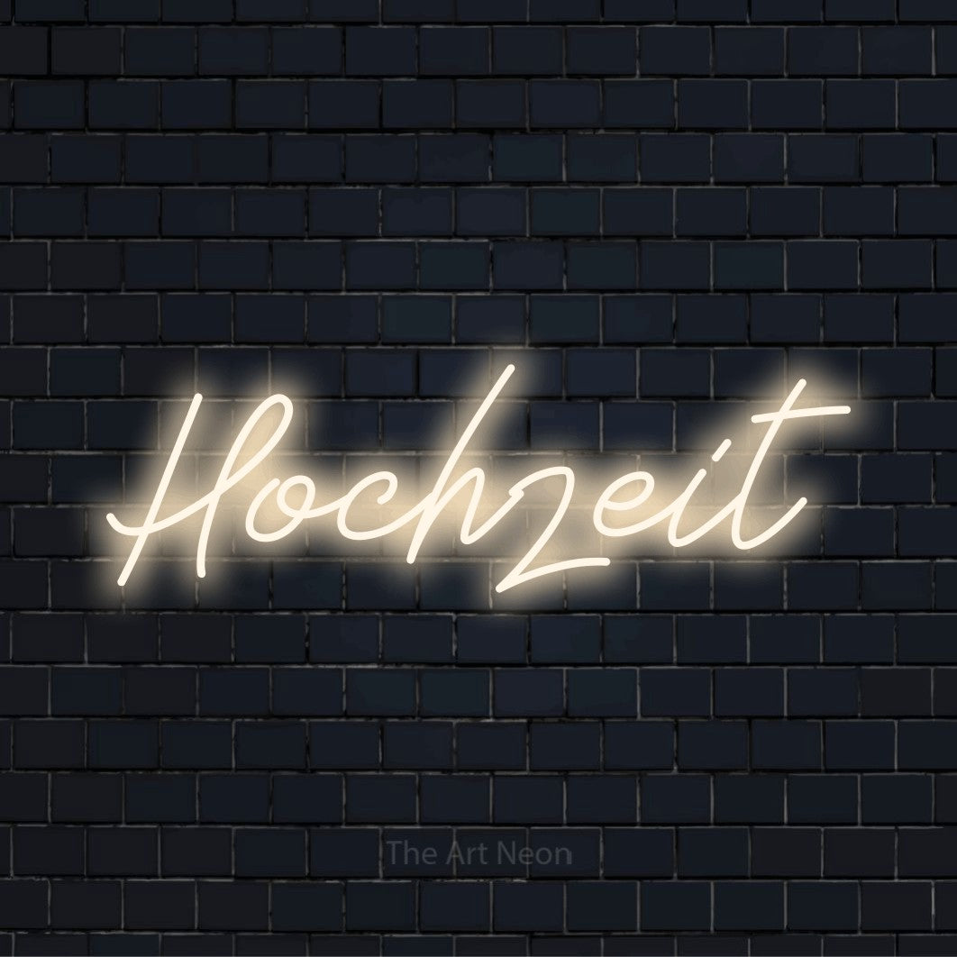 LED-Neonschild mit dem Text „Hochzeit“ auf dunkler Ziegelwand