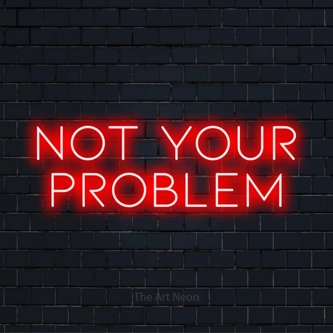 "Not Your Problem" script-style LED neon sign on a black brick wall