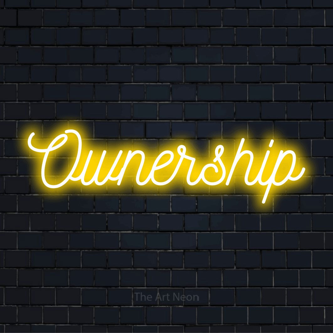 "Ownership" LED neon sign on a black brick wall