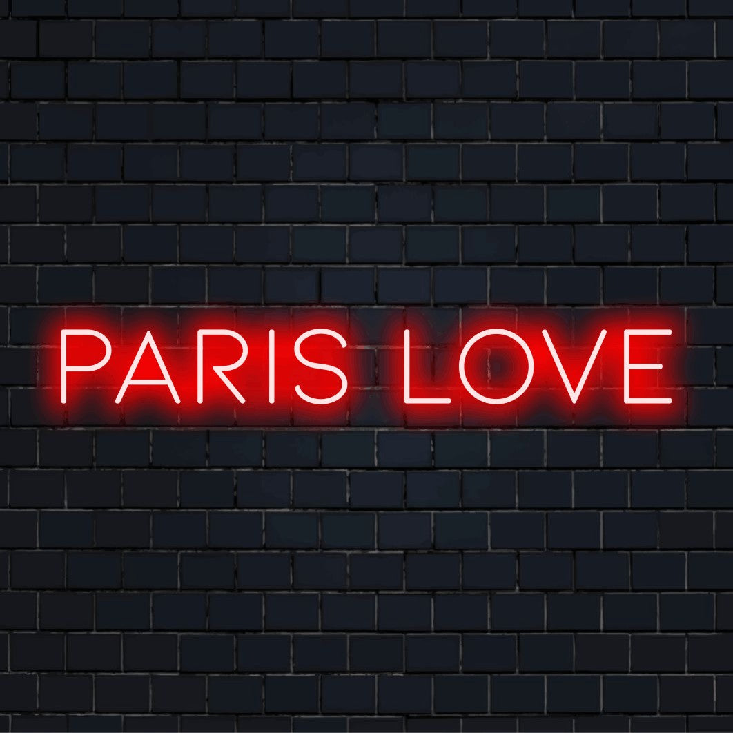 Paris Love Neon Sign, glowing wall decor against black brick wall