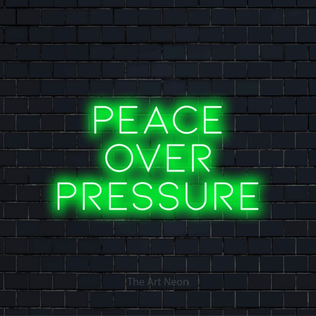 "Peace Over Pressure" neon text design on a black brick wall