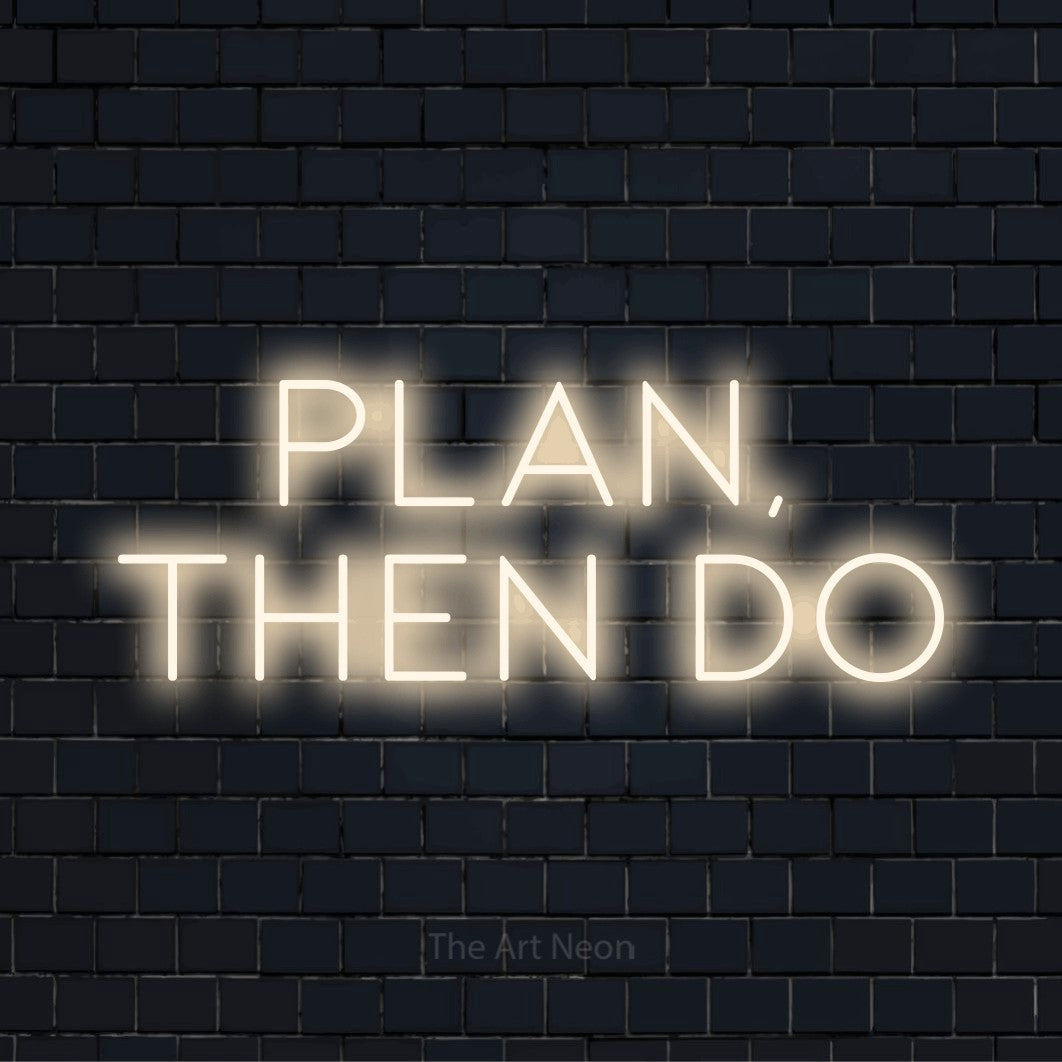 "Plan, Then Do" LED neon sign on a black brick wall