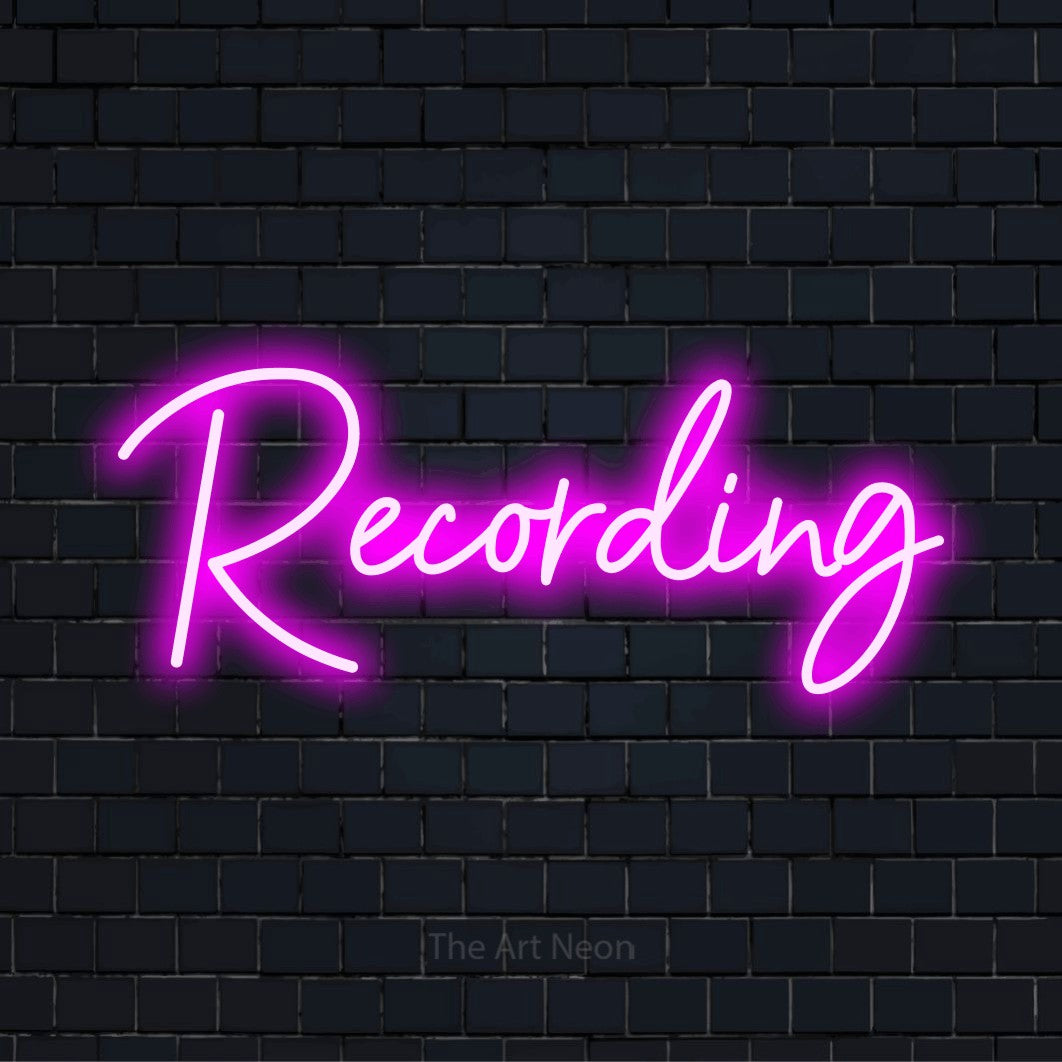 "Recording" glowing LED neon sign on a black brick wall