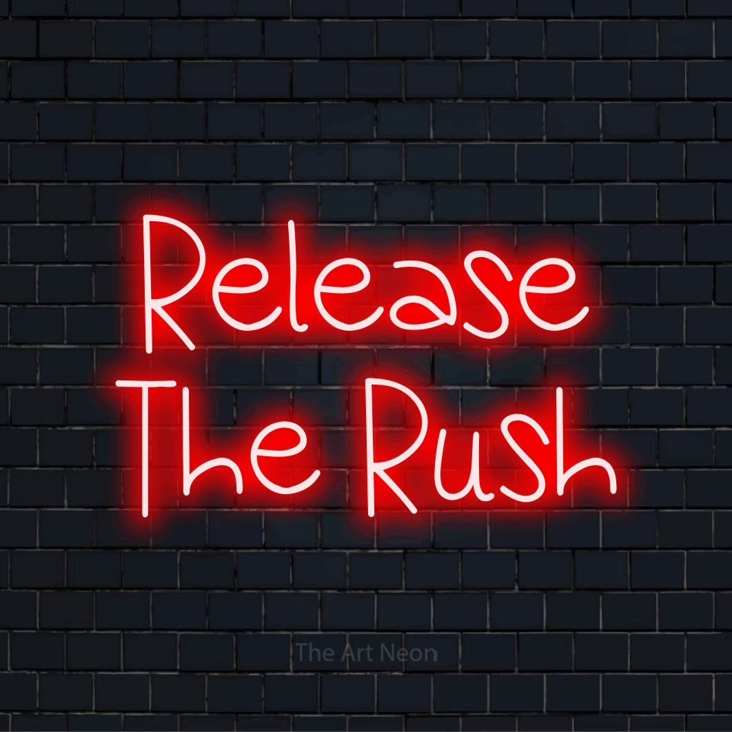 "Release The Rush" glowing LED neon sign on a black brick wall