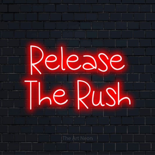 "Release The Rush" glowing LED neon sign on a black brick wall