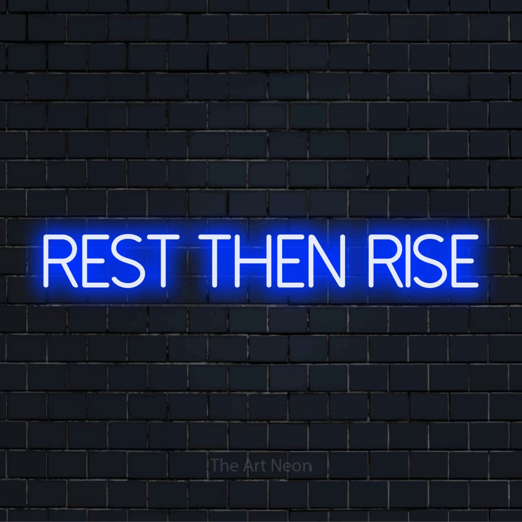 "Rest Then Rise" glowing LED neon sign on a black brick wall